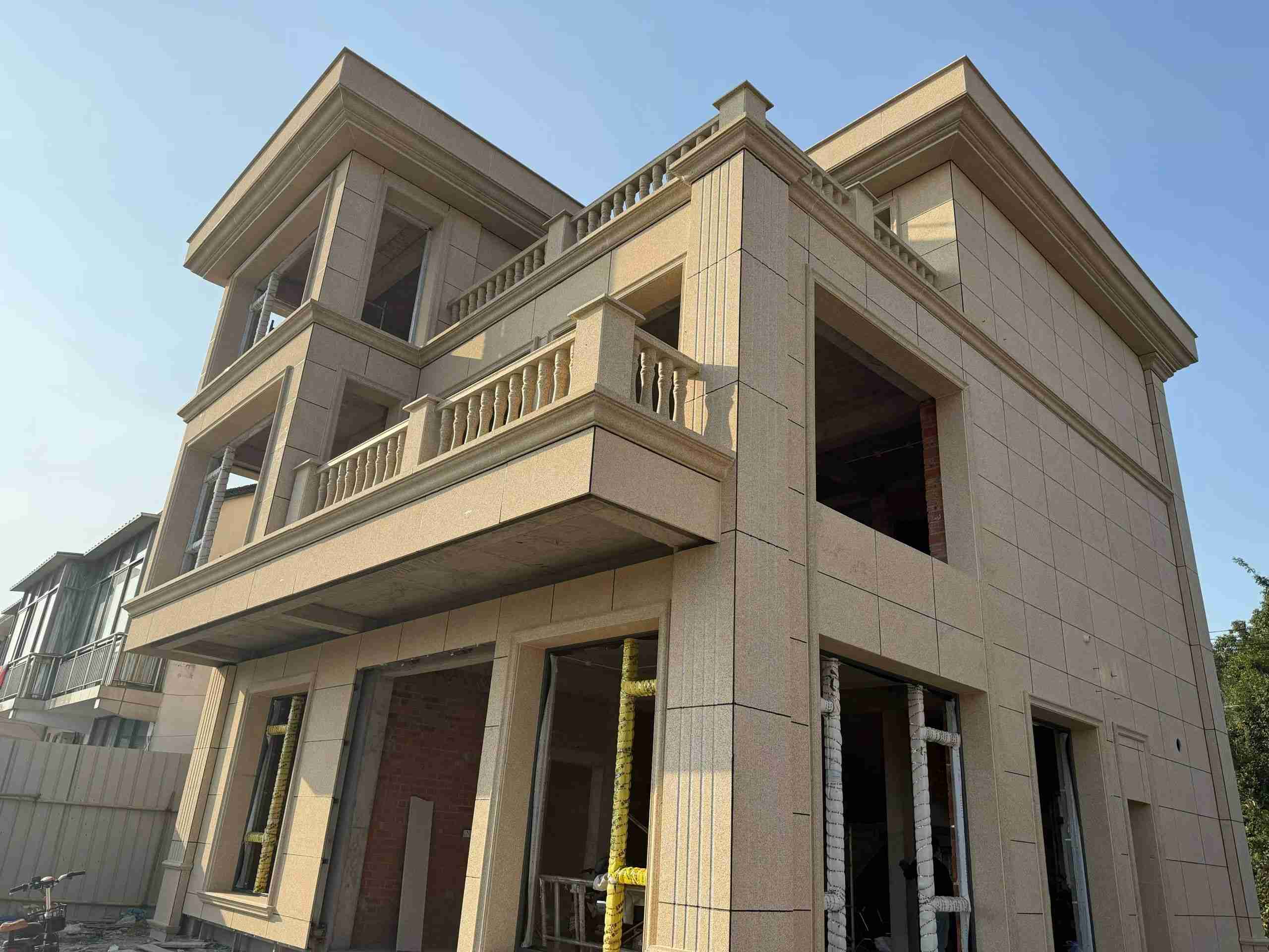 阳泉 黄金麻花岗岩石材荔枝面外墙干挂效果展示